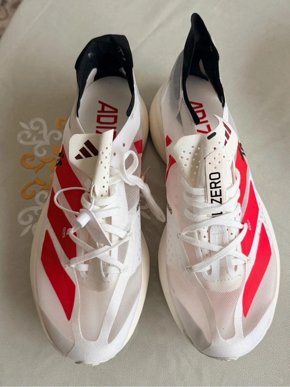 adidas White & Red Running Sneakers - Signature Stripe Design